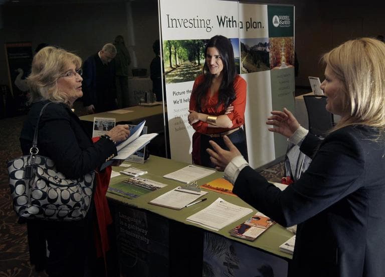 A potential applicant speaks to recruiters during a job fair in Boston in April.(AP/Elise Amendola)