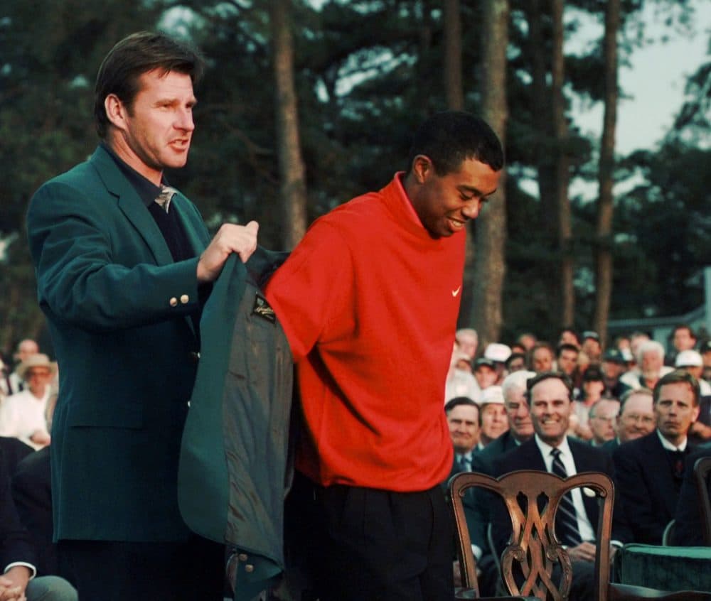 Tiger Woods won his first major championship after a record-breaking performance at the 1997 Masters. Some observers consider it the defining win of his career. (AP)
