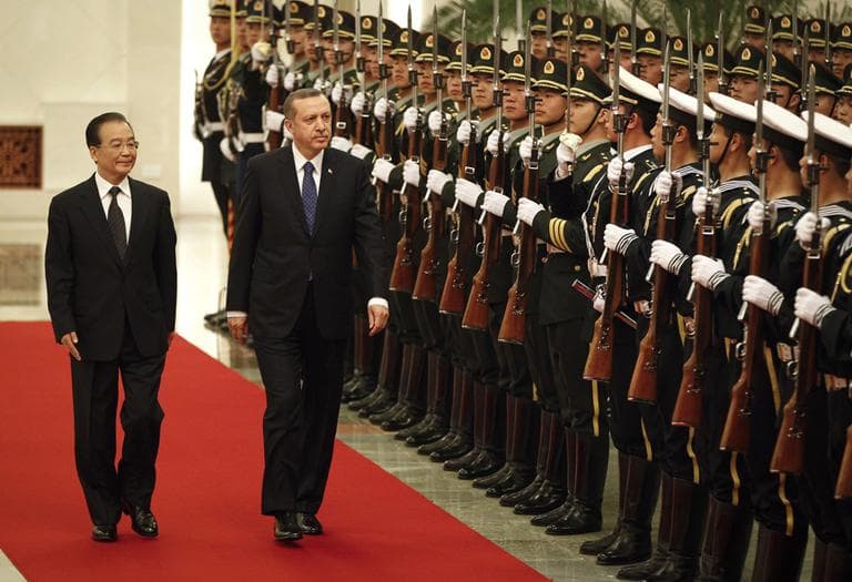 Chinese Premier Wen Jiabao, left, and Turkish Prime Minister Recep Tayyip Erdogan review an honor guard during a welcoming ceremony in Beijing Monday. China acknowledged differences with Turkey over their approach to the continuing violence in Syria, ahead of talks Monday with Turkey&#039;s leader, who is making a rare official visit to Beijing. (AP)