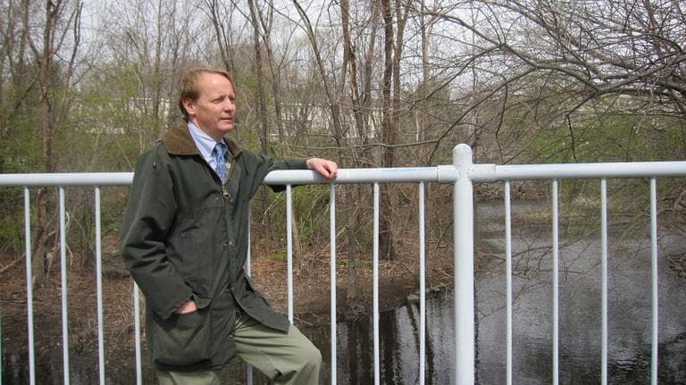 Jonathan Yeo, director of Water Supply Protection for the Massachusetts Department of Conservation and Recreation, at the Cordingly Dam in Newton Lower Falls. (Kathleen McNerney/WBUR)