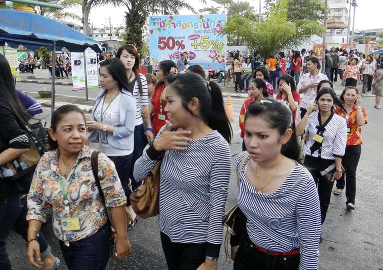 Office workers and residents walk on the street after evacuating from the buildings nearby after an earthquake struck Indonesia&#039;s western coast and shook the buildings in Hat Yai district of Songkhla province, southern Thailand Wednesday, April 11. (AP)