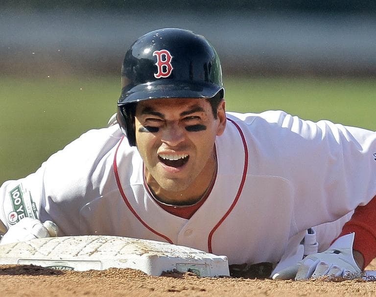 Boston Red Sox&#039; Jacoby Ellsbury grimaces after colliding with Tampa Bay Rays shortstop Reid Brignac at second base on Friday during the Sox&#039; home opener. (AP)