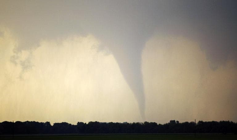 A tornado forms and touches down north of Soloman, Kan., Saturday, April 14, 2012. (AP)