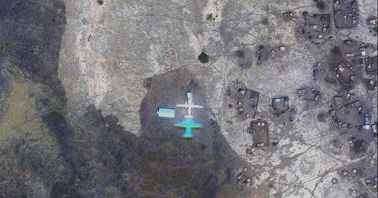 An Antonov AN-26 plane over Tira Mande village in South Kordofan, Sudan (Courtesy of the Satellite Sentinel Project)