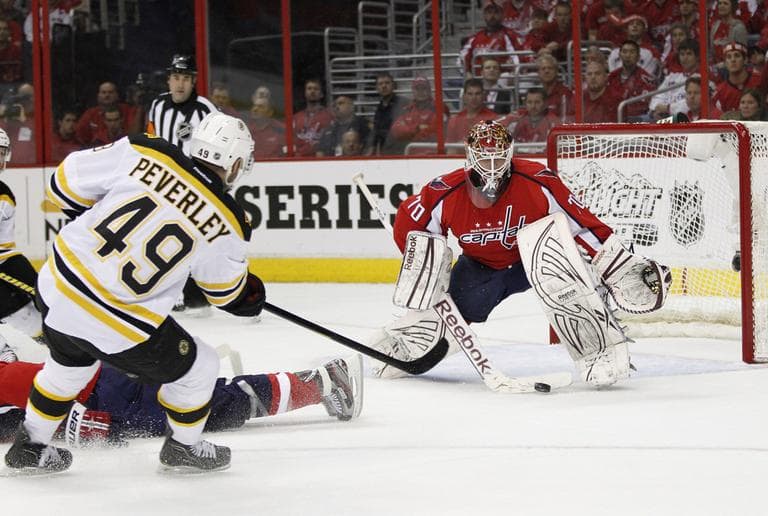 Boston Bruins right wing Rich Peverley beats Washington Capitals goalie Braden Holtby for a goal during the first period of Game 4 on Thursday.  (AP)