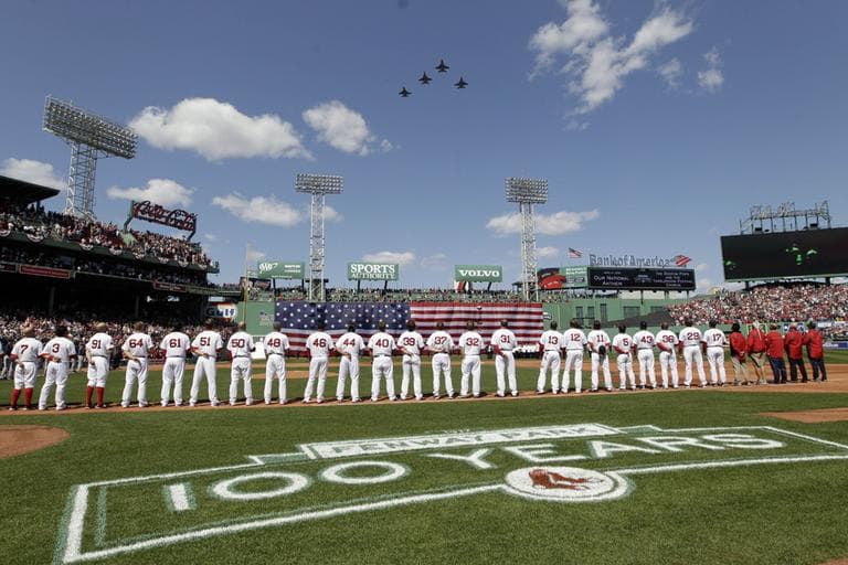 Sox players line up for the national anthem as fighter jets from the Vermont National Guard fly over Fenway, April 13. (AP)