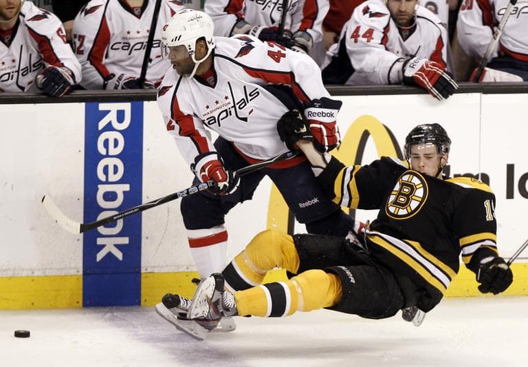 Bruins' Tyler Seguin is dumped by Washington Capitals' Joel Ward (42) during the third period of Washington's 4-3 win in Game 5. (AP)