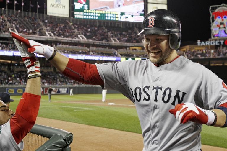 Outfielder Cody Ross celebrates his two-run, game-tying home run off Twins pitcher Jason Marquis in the seventh inning, Monday. (AP)