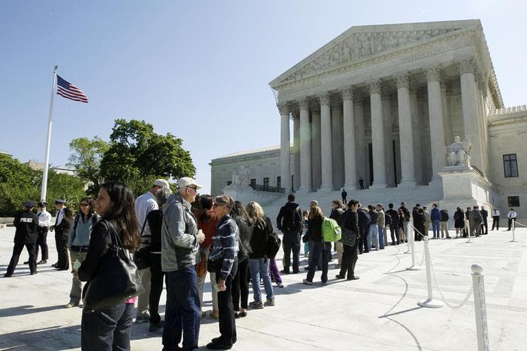 Members of the public line up outside the Supreme Court in Washington, Wednesday, as the court held a hearing on Arizona&#039;s immigration law. (AP)