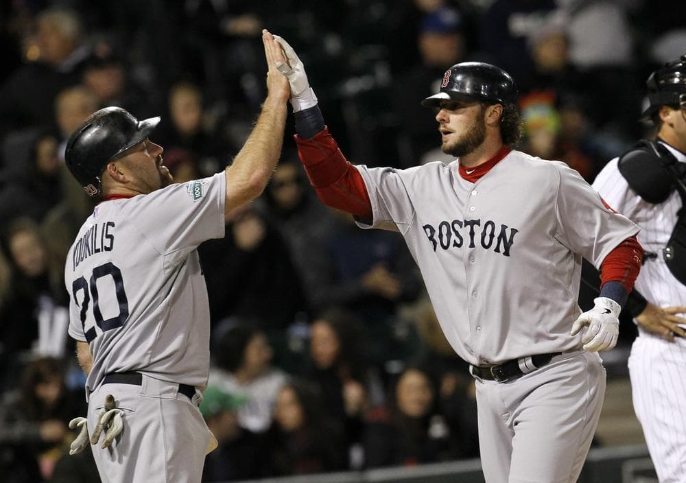 Boston Kevin Youkilis (20) greets teammate Jarrod Saltalamacchia after the pair scored on Saltalamacchia&#039;s second home run of the game, both off Chicago White Sox starting pitcher Philip Humber, during the fifth inning. (AP Photo)