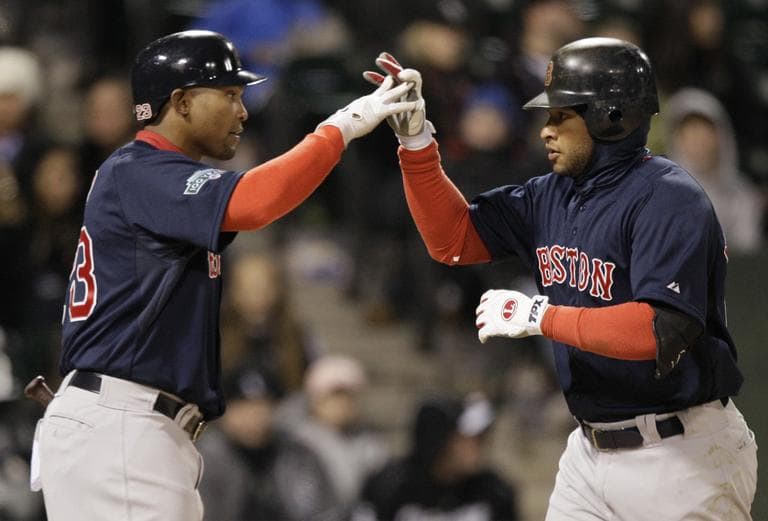 Boston Red Sox&#039;s Darnell McDonald, right, celebrates with Marlon Byrd after hitting a solo home run during the ninth inning against the Chicago White Sox on Friday. (AP)