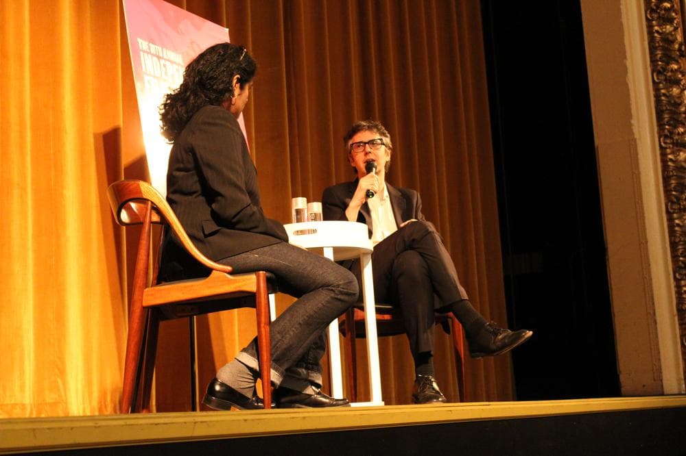 Ira Glass on stage at the Somerville Theatre with WBUR&#039;s Meghna Chakrabarti on Wednesday night. (Lisa Tobin/WBUR)