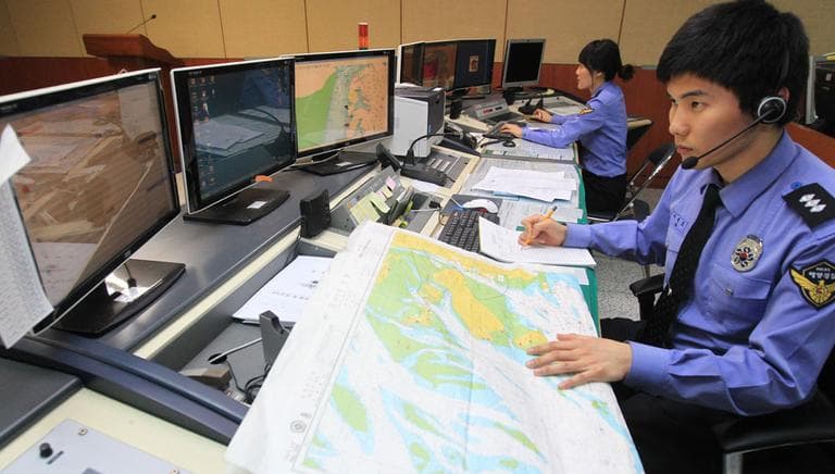 South Korean officials of the Incheon Maritime Police Agency monitor a situation room while on high alert in preparation for North Korea's planned launch of a Unha-3 rocket, in Incheon, South Korea, Thursday, April 12, 2012. (AP)