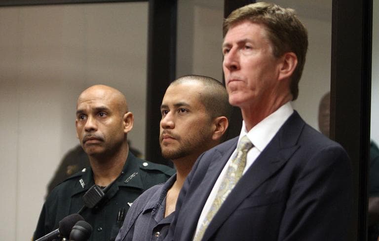 George Zimmerman, center, stands with his attorney Mark O'Mara, right, and a Seminole County Deputy during a court hearing Thursday April 12, 2012, in Sanford, Fla. Zimmerman has been charged with second-degree murder in the shooting death of the 17-year-old Trayvon Martin. (AP)