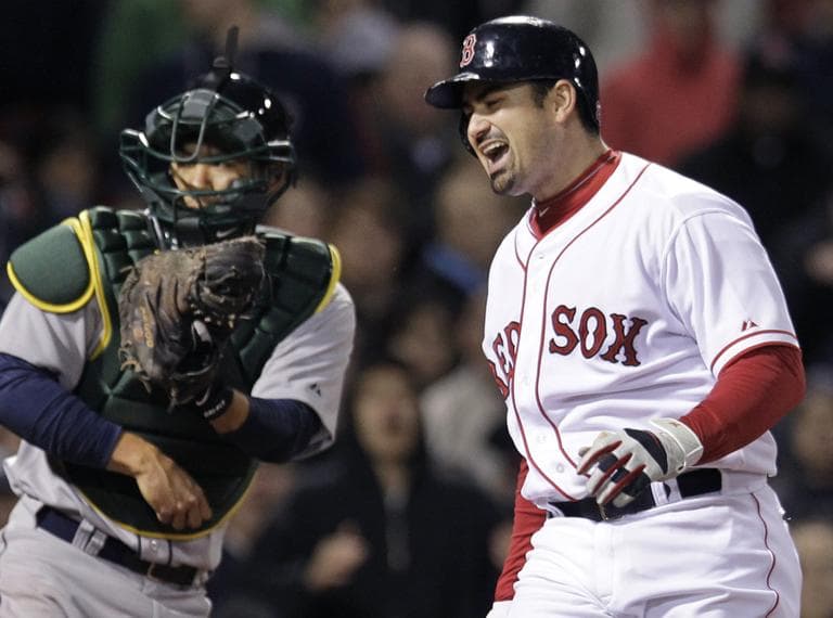 Boston Red Sox&#039;s Adrian Gonzalez yells after striking out and leaving the bases loaded in the seventh inning against the Oakland Athletics on Wednesday. (AP)