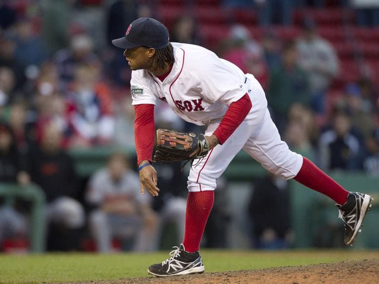 Boston Red Sox&#039;s Darnell McDonald watches a pitch to a Baltimore Orioles batter in the 17th inning of a baseball game at Fenway Park on Sunday. (AP)