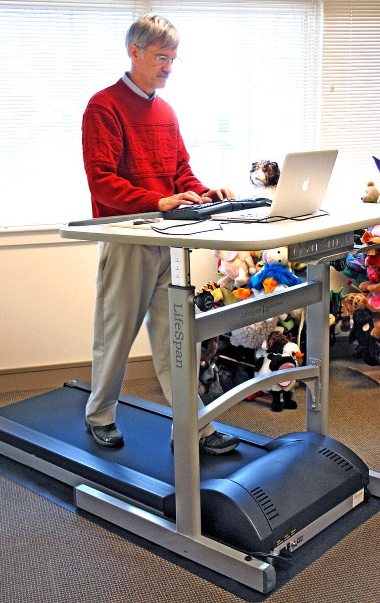 Alan Sparrow demonstrates a Treadmill Desk in Salt Lake City. It turns out that standing at your desk can help prevent heart attacks. (AP)