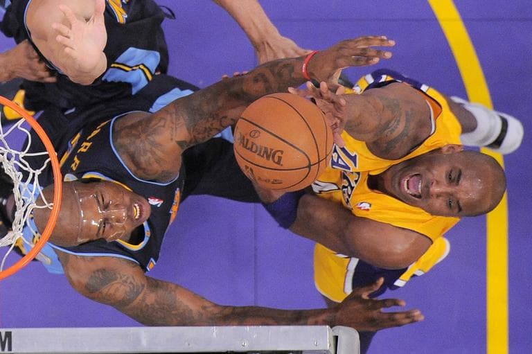 Los Angeles Lakers shooting guard Kobe Bryant, right, puts up a shot as Denver Nuggets power forward Al Harrington defends during the first half in Game 5 of an NBA first-round playoff basketball game, Tuesday, May 8, 2012, in Los Angeles. The Nuggets won 102-99. (AP)