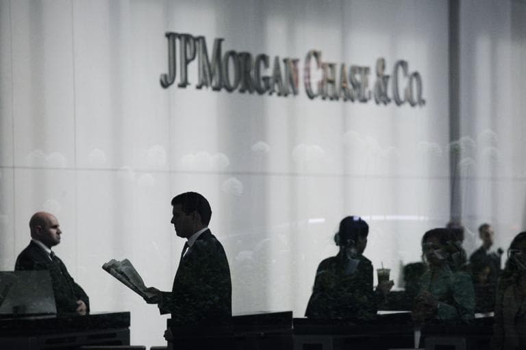 People arrive at JPMorgan Chase headquarters in New York Monday, May 14, 2012. JPMorgan, the largest bank in the United States, is seeking to minimize the damage caused by a $2 billion trading loss, disclosed Thursday by CEO Jamie Dimon. (AP)