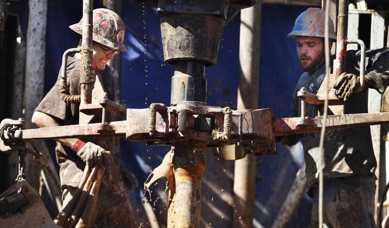 Oil field workers drill into the Gypsum Hills near Medicine Lodge, Kan., using horizontal drilling and a technique known as hydraulic fracturing, or fracking. (AP)