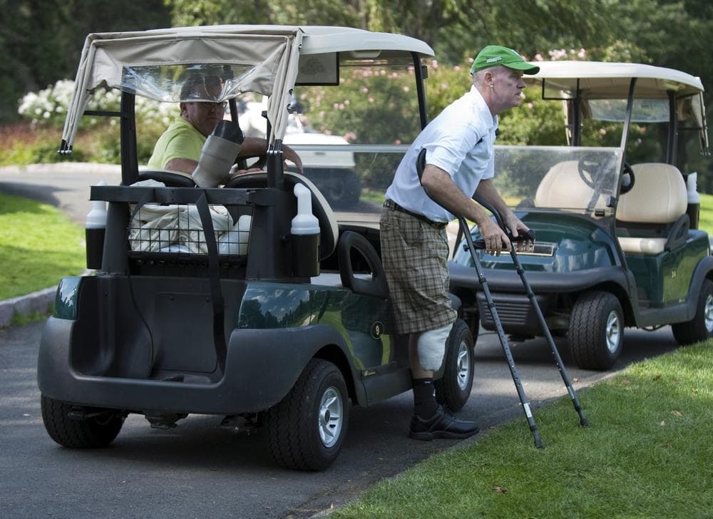 Ken Green, pictured here in 2009, steps off a golf cart preparing for a round. (AP)