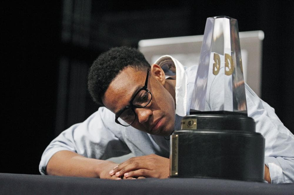 Jabari Parker reads the names of prior winners on the trophy as he is named Gatorade National Boys Basketball Player of the Year in April. (AP)