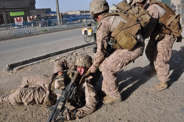 A marine in Afghanistan just after he was wounded by a roadside bomb. (Michael M. Phillips/Wall Street Journal)