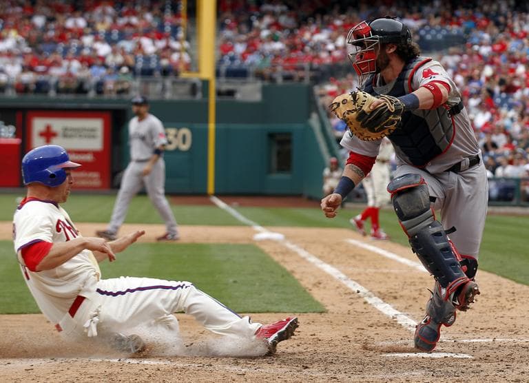 Red Sox catcher Jarrod Saltalamacchia, right, gets out of the way as Philadelphia Phillies&#039; Pete Orr slides safely into home. (AP)