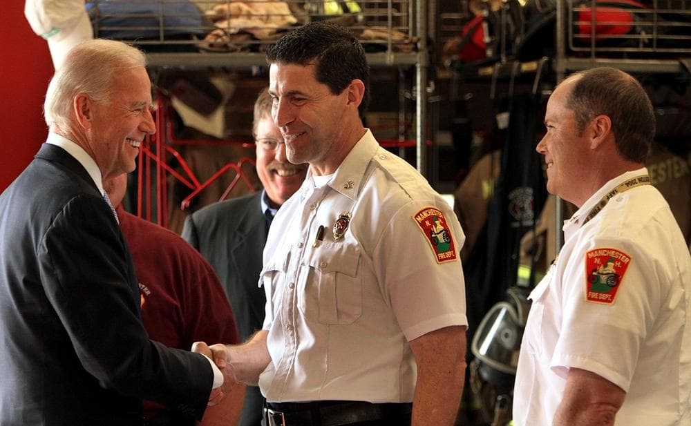 Vice President Joe Biden greets firefighters at the fire department station in Manchester, N.H., on Tuesday.  (AP Photo/Jim Cole)
