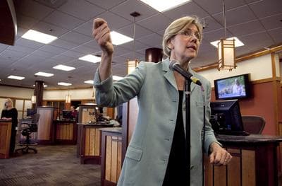 Democrat candidate for the U.S. Senate Elizabeth Warren responds to questions from reporters on her Native American heritage during a news conference at Liberty Bay Credit Union headquarters, in Braintree, Mass. in May. (AP Photo/Steven Senne)