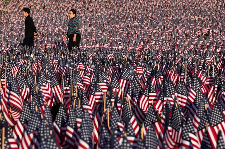 Relatives and volunteers planted 33,000 American flags in Boston Common in advance of Memorial Day Weekend and in tribute to Massachusetts soldiers killed in conflicts as far back as the Civil War. (AP)