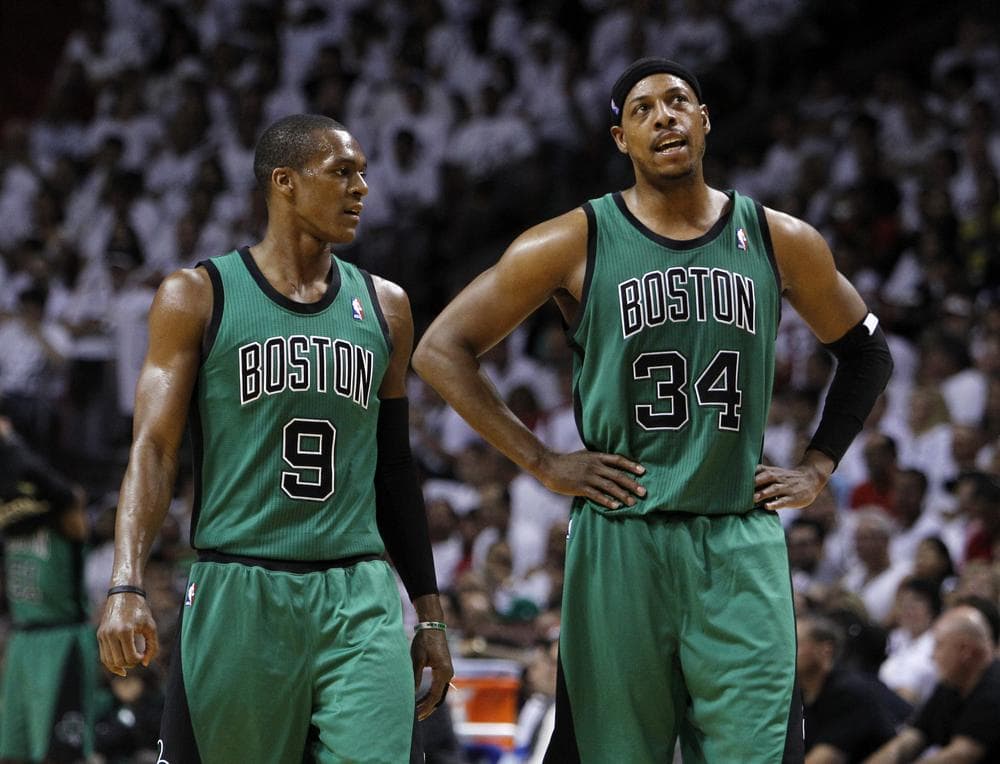 Paul Pierce and Rajon Rando talk during the first half of Game 1 of the Eastern Conference finals. (AP)