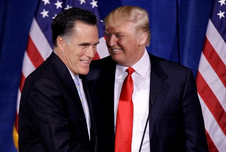Donald Trump greets Republican presidential candidate Mitt Romney, after announcing his endorsement of Romney during a news conference in February. (AP Photo/Julie Jacobson)