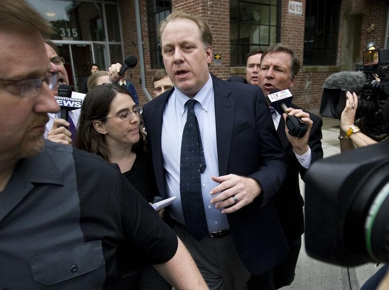 Curt Schilling, center, is followed by members of the media as he departs the Rhode Island Economic Development Corporation headquarters, in Providence, R.I., Wednesday, May 16, 2012. Schilling briefed Rhode Island Gov. Lincoln Chafee and economic development officials Wednesday during a closed-door meeting. (AP Photo/Steven Senne)
