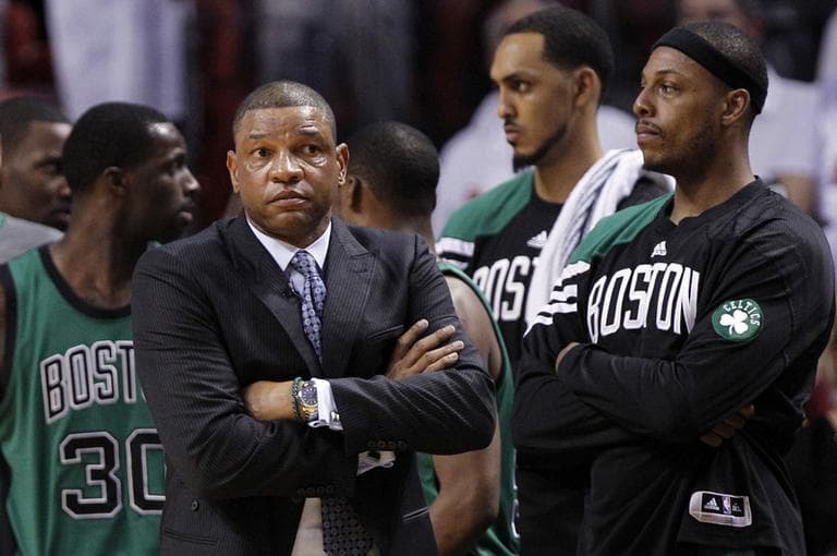 Boston Celtics head coach Doc Rivers, left, and Paul Pierce, right, watch during the final minutes of overtime in the team&#039;s loss to Miami in Game 2 of the Eastern Conference finals. (AP)