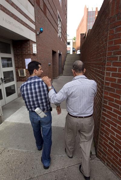 Oscar Ramirez, left, and his father Tranquilino Castaneda, right, arrive at the Harvard Kennedy School Carr Center for Human Rights Policy in Cambridge, May 30. (AP)
