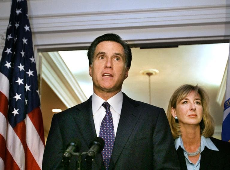 Gov. Mitt Romney, left, faces reporters as Lt. Gov. Kerry Healy looks on at the Statehouse, in Boston, on Aug. 3, 2004. (AP Photo/Steven Senne)