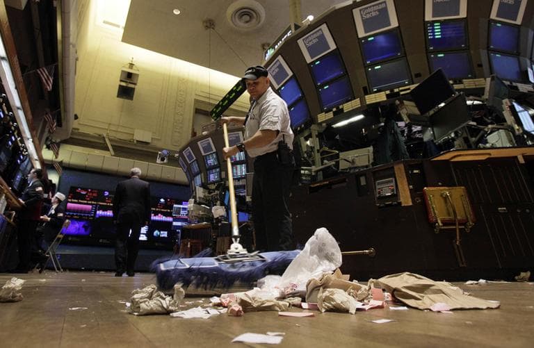 In this Friday, June 1, 2012, file photo, Raul Rodriguez sweeps the trading floor of the New York Stock Exchange. The global economy’s foundations are weakening, one by one. The global economy's foundations are weakening, one by one. Already hobbled by Europe's debt crisis, the world now risks being hurt by slowdowns in its economic powerhouses. (AP)