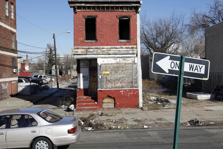 This file photo shows boarded-up buildings in Camden, N.J. The ranks of America's poor have climbed to a record high, according to new census data that paints a stark portrait. (AP)