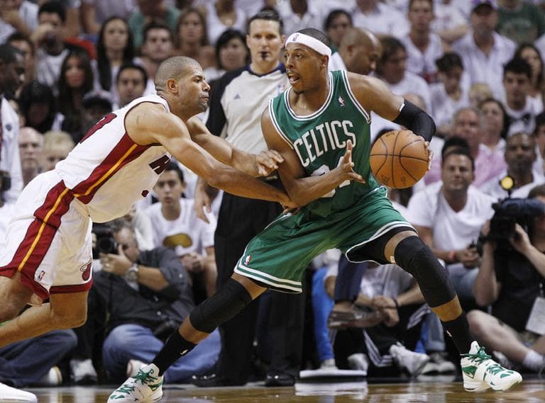 Boston Celtics&#039; Paul Pierce (34) dribbles the ball as Miami Heat&#039;s Shane Battier (31) defends during the first half of Game 5 in their NBA basketball Eastern Conference finals playoffs series, Tuesday, June 5, 2012, in Miami. (AP Photo/Lynne Sladky)