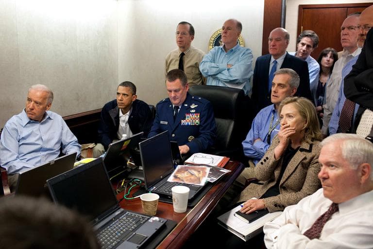 The image released by the White House and digitally altered by the source to obscure the details of a document in front of Secretary of State Hillary Rodham Clinton, at right with hand covering mouth, President Barack Obama, second from left, Vice President Joe Biden, left, Secretary of Defense Robert Gates, right, and members of the national security team watch an update on the mission against Osama bin Laden in the Situation Room of the White House in Washington. (AP)