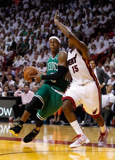 The Celtics' Rajon Rondo drives against the Heat's Mario Chalmers during Game 5 Tuesday in Miami. (AP)