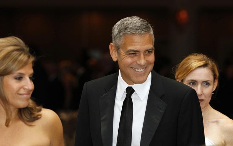 George Clooney, center, attends the White House Correspondents&#039; Association Dinner in April in Washington. President Obama&#039;s campaign fundraiser at George Clooney&#039;s house last month raised $15 million. (AP)
