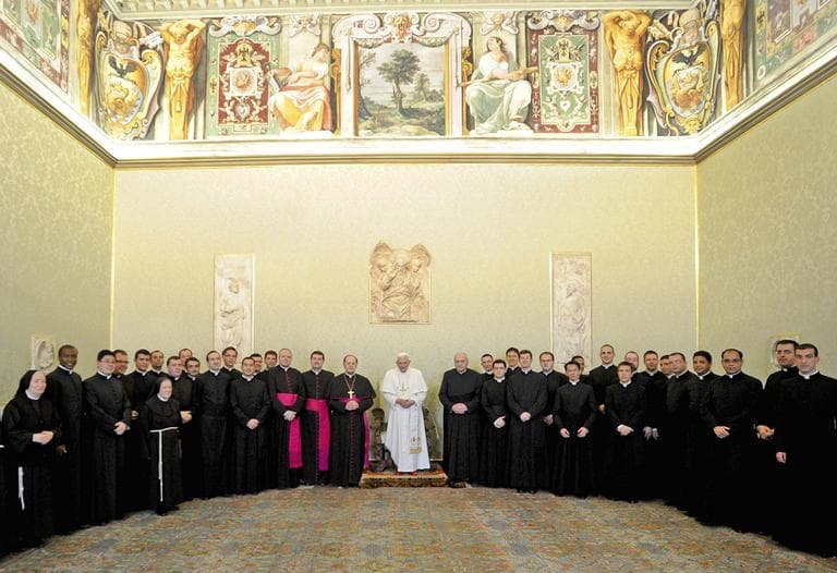 Pope Benedict XVI, center, poses during a private audience at the Vatican with a group of prelates preparing to serve the Holy See abroad in diplomatic posts. (AP Photo/L&#039;Osservatore Romano)