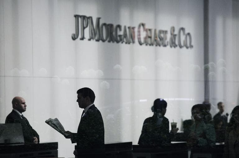 People arrive at JPMorgan Chase headquarters in New York Monday, May 14, 2012.(AP)