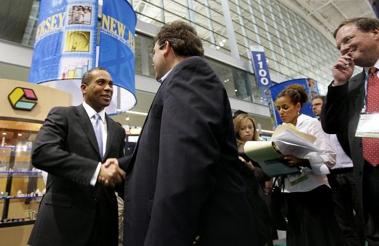Gov. Deval Patrick greets a visitor during the Biotech convention in Boston, Tuesday May 8, 2007. (AP Photo/Charles Krupa)