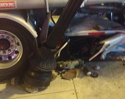 The fuel tanker drove over the base of a street light on Dorchester Ave., rupturing its tank. (Courtesy @BostonFire)