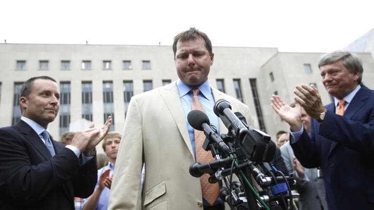 Former Major League Baseball pitcher Roger Clemens, center, is applauded by his attorney&#039;s, Rusty Hardin, right, and Michael Attanasio, left, outside federal court in Washington, Monday. (AP)