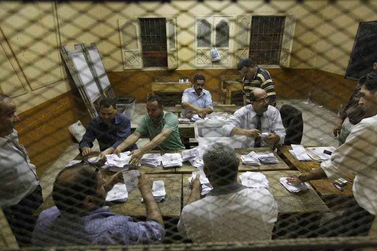 Egyptian elections officials count ballots at a polling center during the second day of the presidential runoff, in Cairo, Egypt, Sunday, June 17, 2012. (AP)