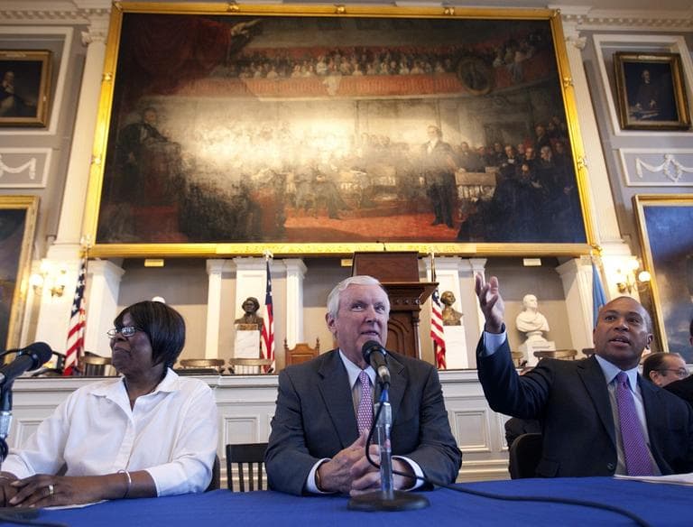 The Supreme Court will decide next week whether or not it is unconstiutional to require people to purchase health insurance. Above, Massachusetts Gov. Deval Patrick, right, sits on a panel with Chairman of Partners HealthCare Jack Connors, center, and health care client Mona Rudolph, left, at Faneuil Hall in Boston, Wednesday, April 11, 2012. (AP)